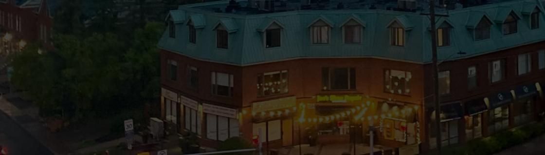 The Dhruvees restaurant building on Beechwood Avenue at dusk